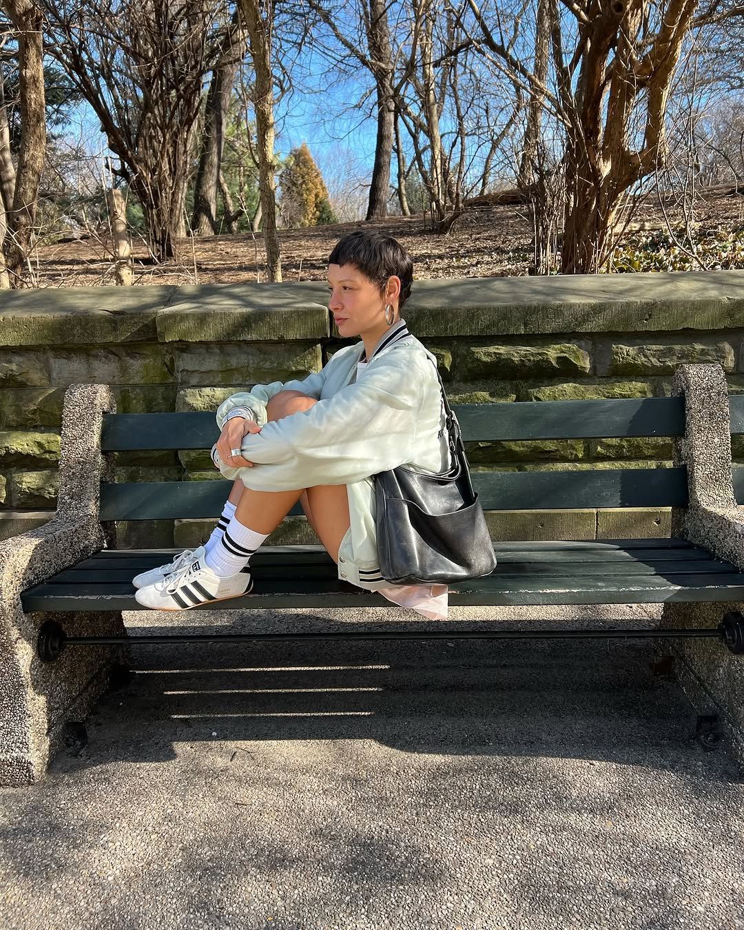 Aisha wearing Adidas Tokyos and sporty white ensemble