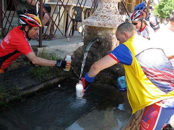 Stocking up at a fountain on the Col du Lautaret.