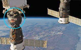 Space station astronauts patched a small hole in the upper orbital module of the Soyuz MS-09 spacecraft (left) on Aug. 30, 2018. Russian space officials have said that hole was likely caused by a drill here on Earth; investigators are currently trying to figure out exactly what happened.