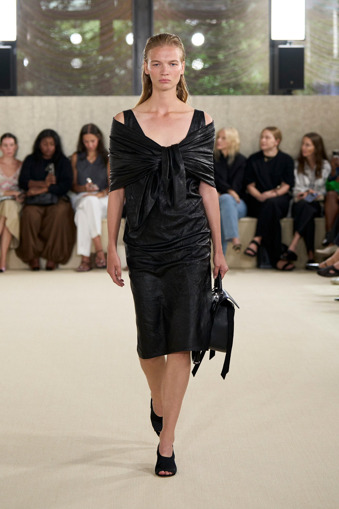 A model wore slingback sandals on the Toteme Spring 2026 runway