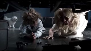 Essie Davis as Amelia Vanek and Noah Wiseman as Samuel Vanek in the horror movie The Babadook.