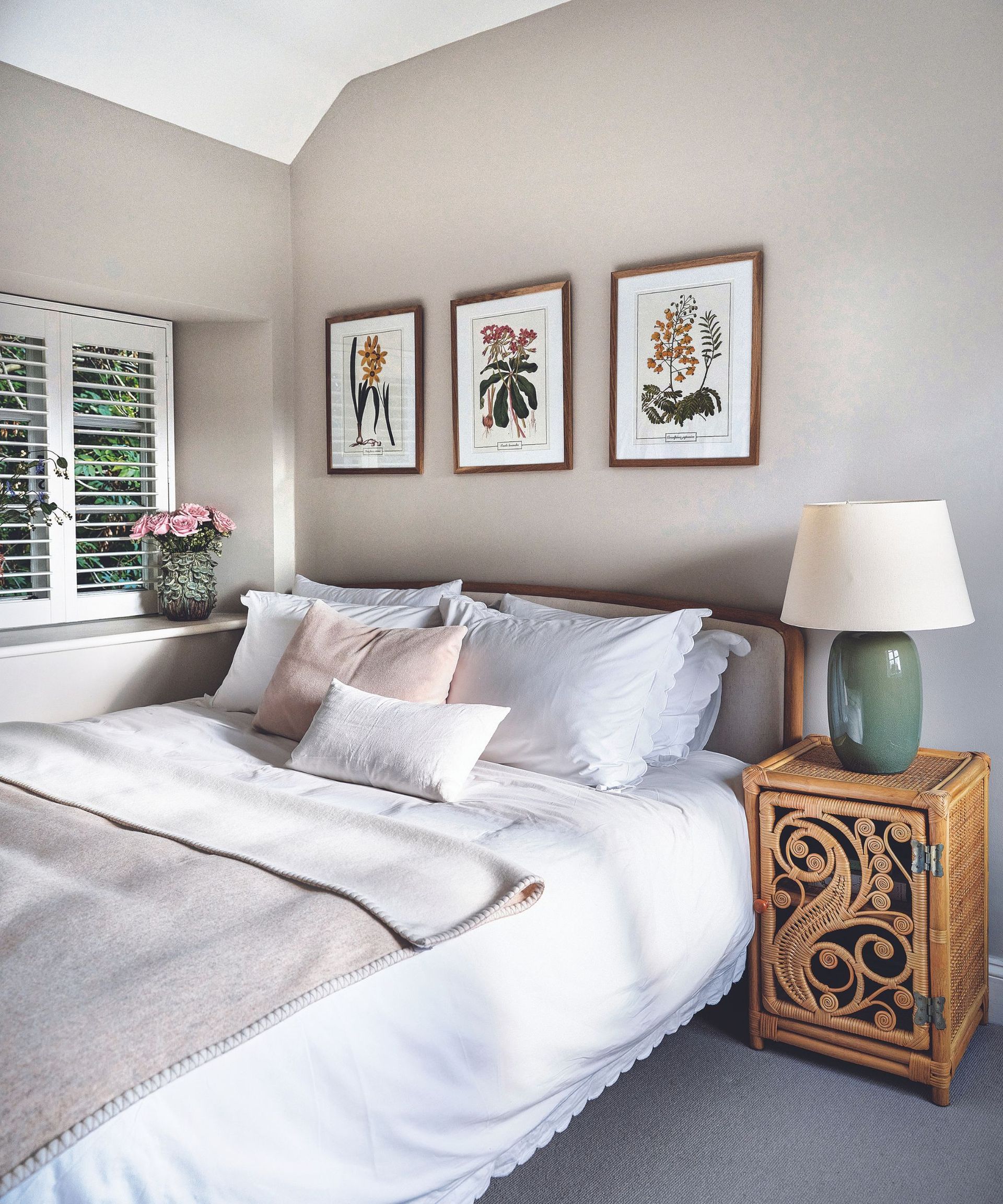 Green bedside lamps, flower pictures, wooden bedside table