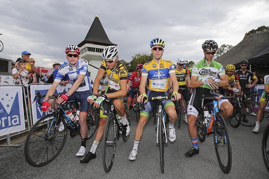 The jersey wearers line up in front of the Mitchelton Winery tower