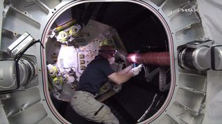 NASA astronaut Jeff Williams is shown here in the Bigelow Expandable Activity Module (BEAM) on June 6, 2016 (the picture was taken from outside the BEAM hatch). Astronauts will not occupy BEAM full time, but will periodically enter the habitat to collect data and check the status of the module.