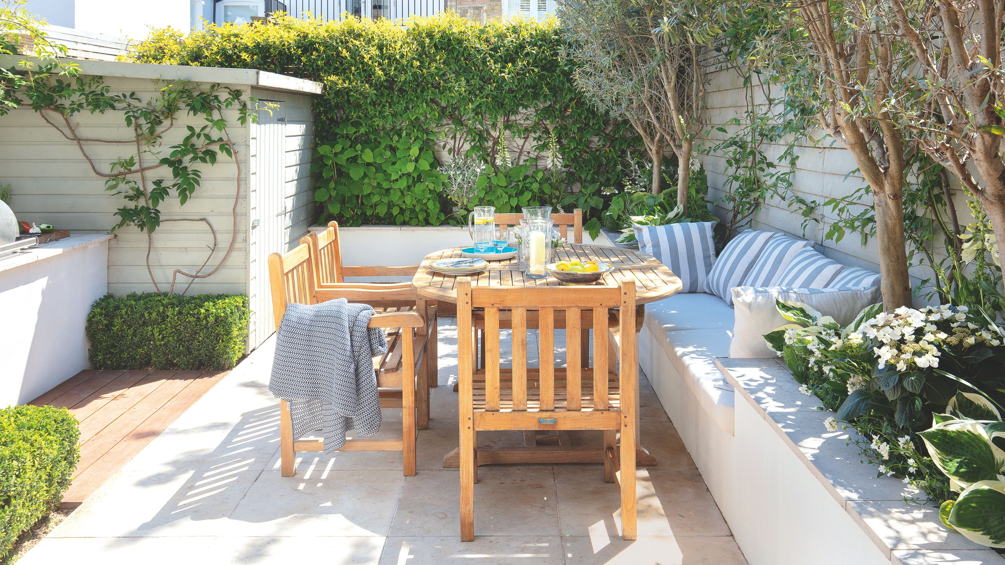 Outdoor seating area with a wooden table and chairs