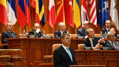 Romania's President Klaus Iohannis delivers a speech in front of NATO's Parliamentary Assembly on Monday