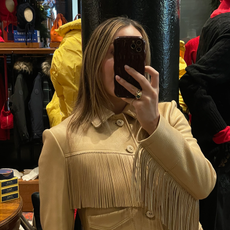 Who What Wear senior fashion editor Anna LaPlaca wearing a beige leather fringe jacket at the Polo Ralph Lauren store in New York