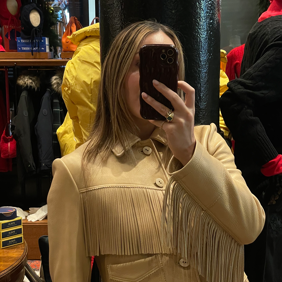 Who What Wear senior fashion editor Anna LaPlaca wearing a beige leather fringe jacket at the Polo Ralph Lauren store in New York