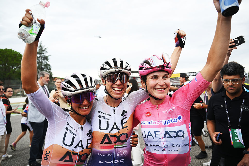 IMOLA, ITALY - JULY 13: (L-R) Erica Magnaldi of Italy, Brodie Chapman of Australia and overall race winner Elisa Longo Borghini of Italy and UAE Team ADQ - Pink Leader Jersey react after the 36th Giro d'Italia Women 2025, Stage 8 a 134km stage from Forli to Imola / #UCIWWT / on July 13, 2025 in Imola, Italy. (Photo by Luc Claessen/Getty Images)