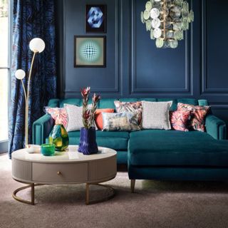 Blue corner style sofa with patterned cushions