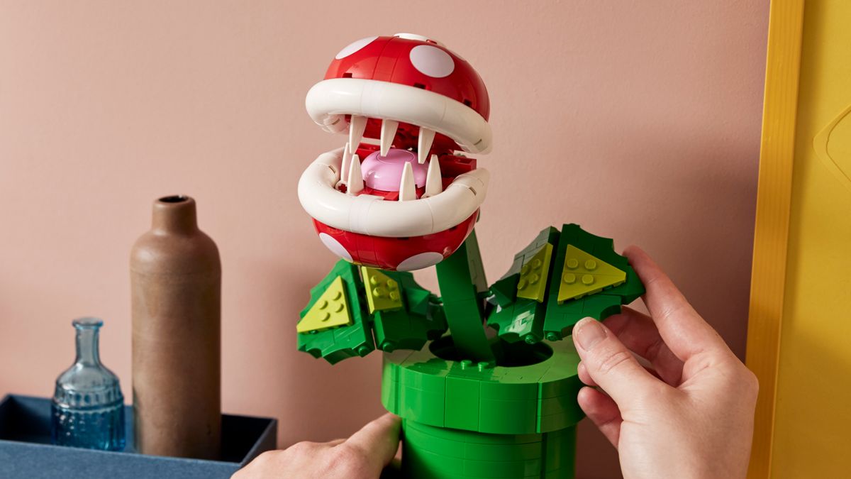 Lego Piranha Plant on a shelf has its leaves adjusted