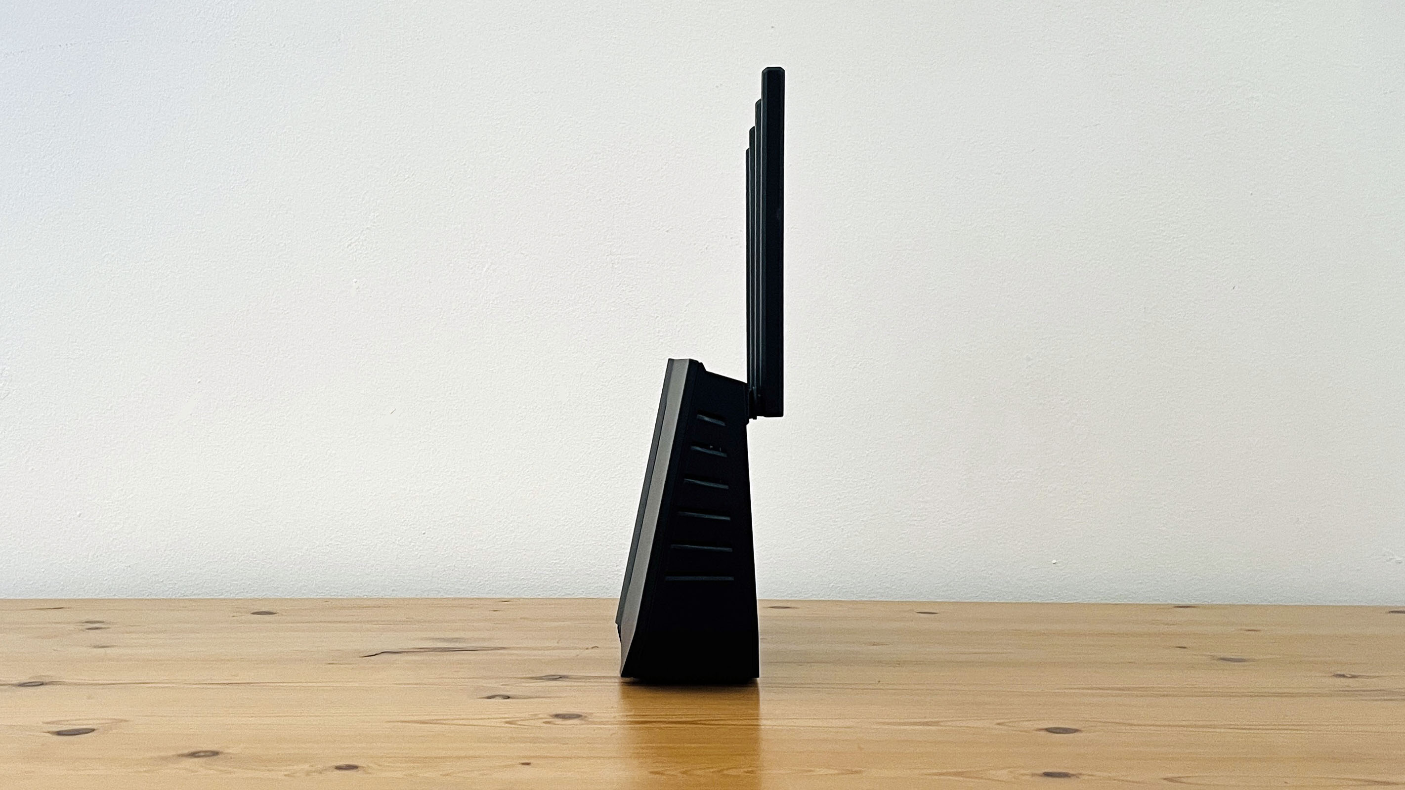 Asus RT-BE92U router on wooden table