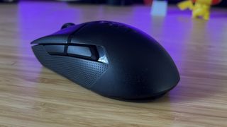 NZXT Lift Elite Wireless gaming mouse on a wooden desk