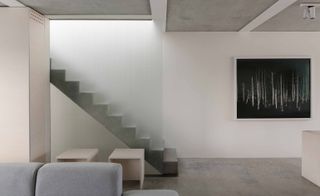 Inside Slip House, the floor, ceiling and staircase are formed from polished concrete
