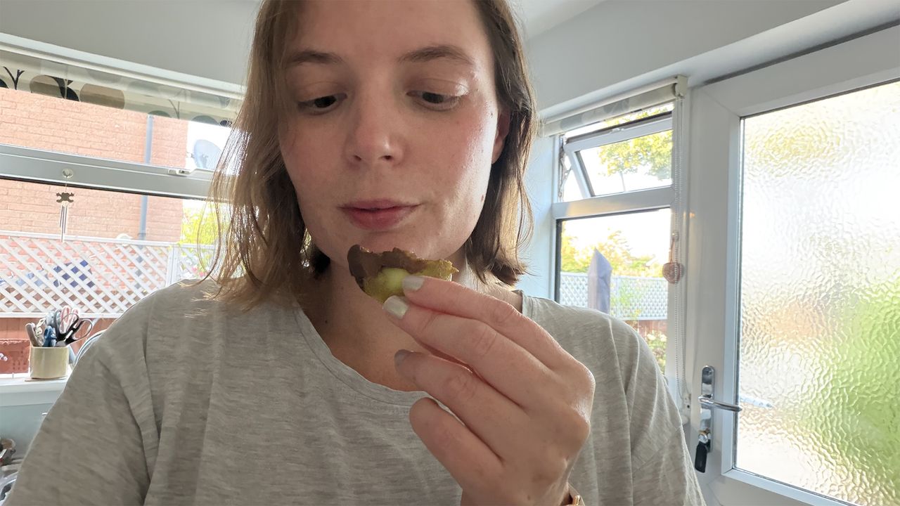 Sleep writer Ruth Jones eats a slice of kiwi dipped in dark chocolate