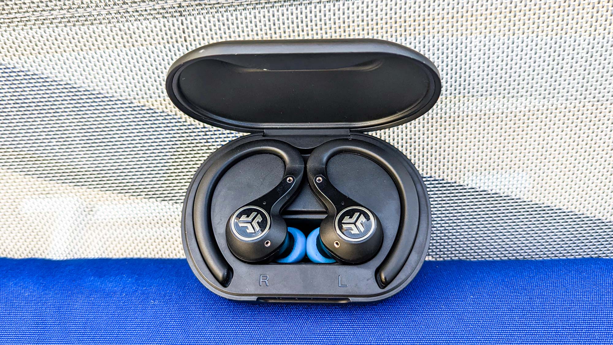 JLab Epic Air ANC 2 headphones in charging case on a cloth background