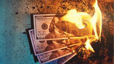 Hundred dollar bills on fire.