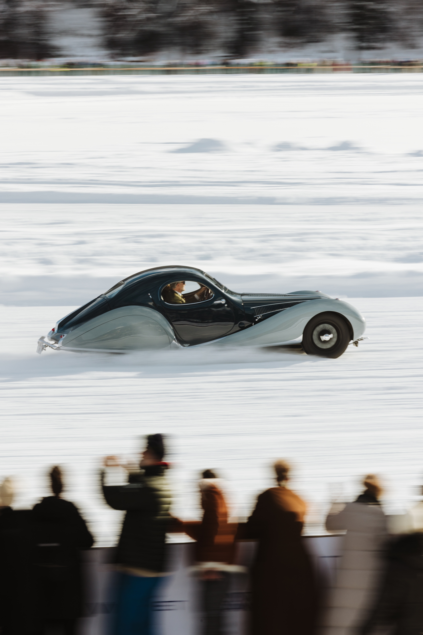 A car takes a lap of the St Moritz ice