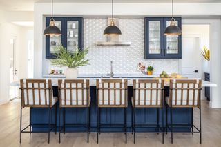 blue kitchen with marble countertops by Blythe Interiors