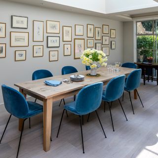 dining with grey walls and wooden dining table