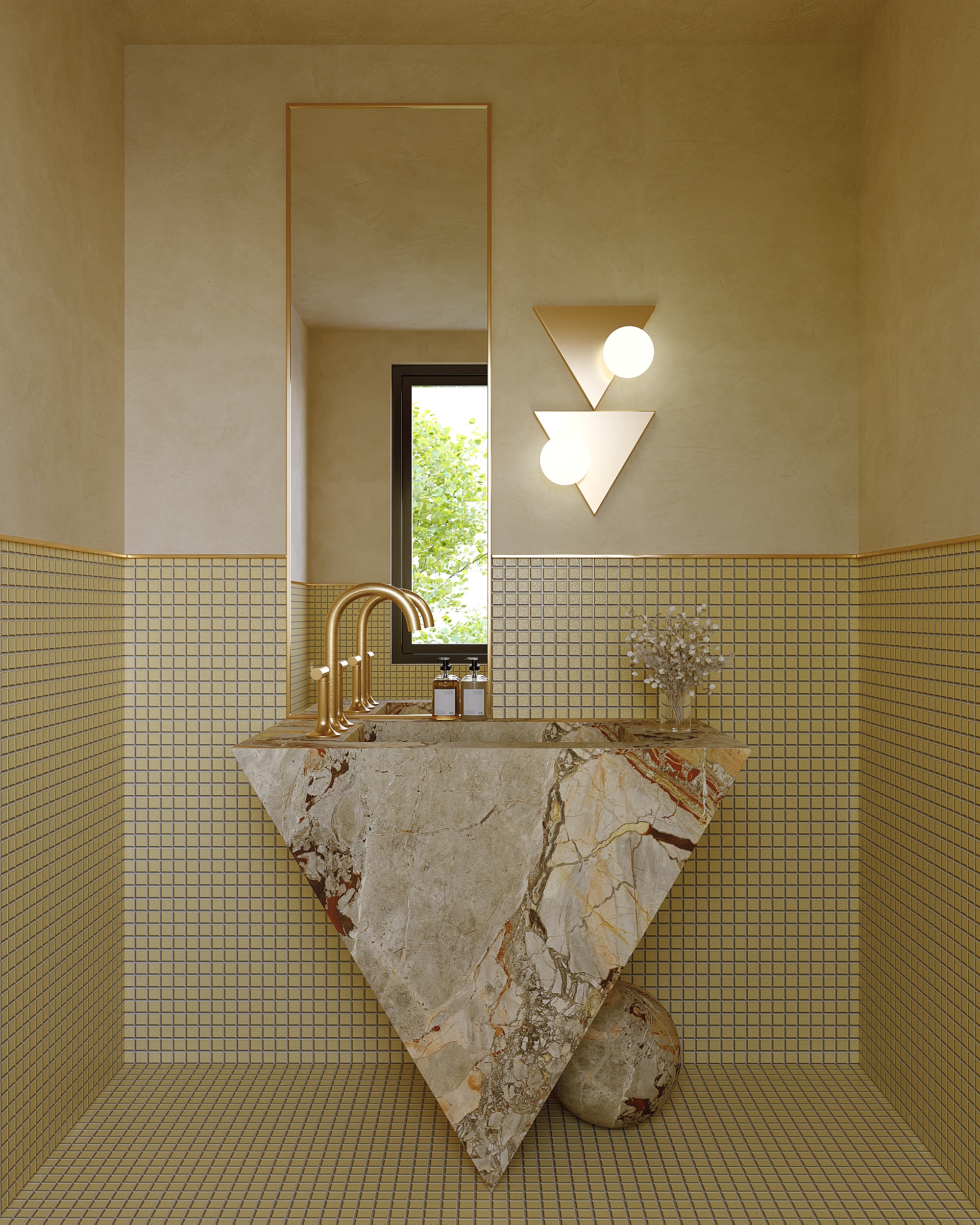A bathroom with marble basin, gold taps and dull yellow tiles