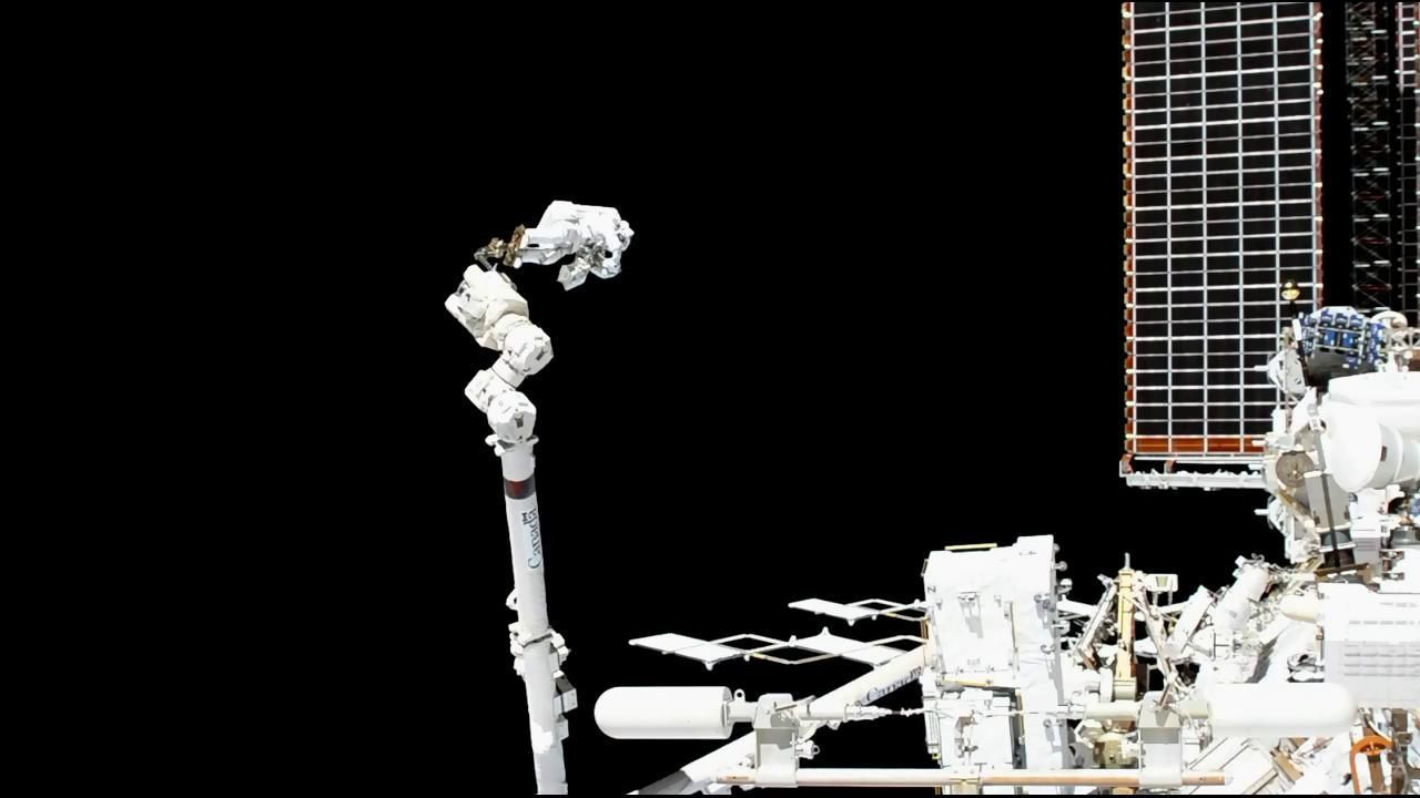 Astronaut Luca Parmitano of the European Space Agency rides the Canadarm2 robotic arm during a Nov. 15, 2019 spacewalk with NASA astronaut Andrew Morgan to begin repairs on a $2 billion Alpha Magnetic Spectrometer instrument on the International Space Station.