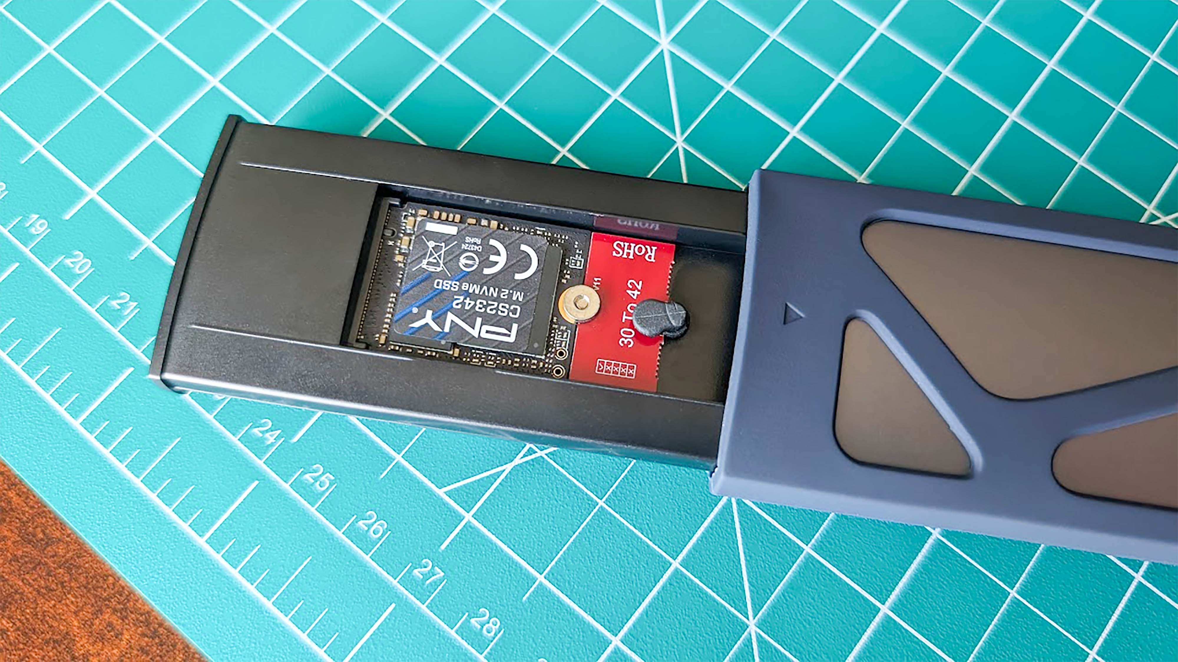A PNY 2TB M.2 2230 SSD inside a UGREEN SSD Enclosure.