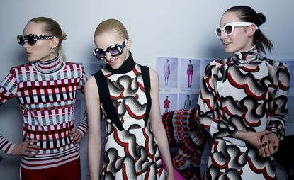 3 female models at London Fashion week wearing Jonathan Saunders clothing