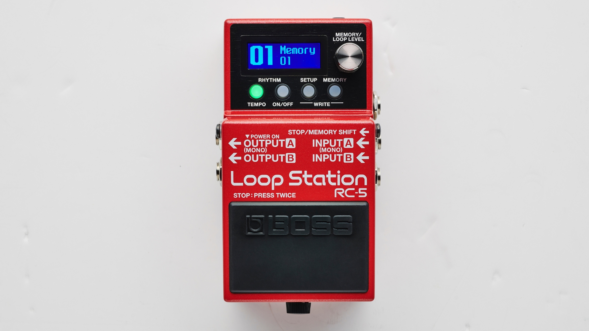 A Boss RC-5 loop pedal lying on a white floor