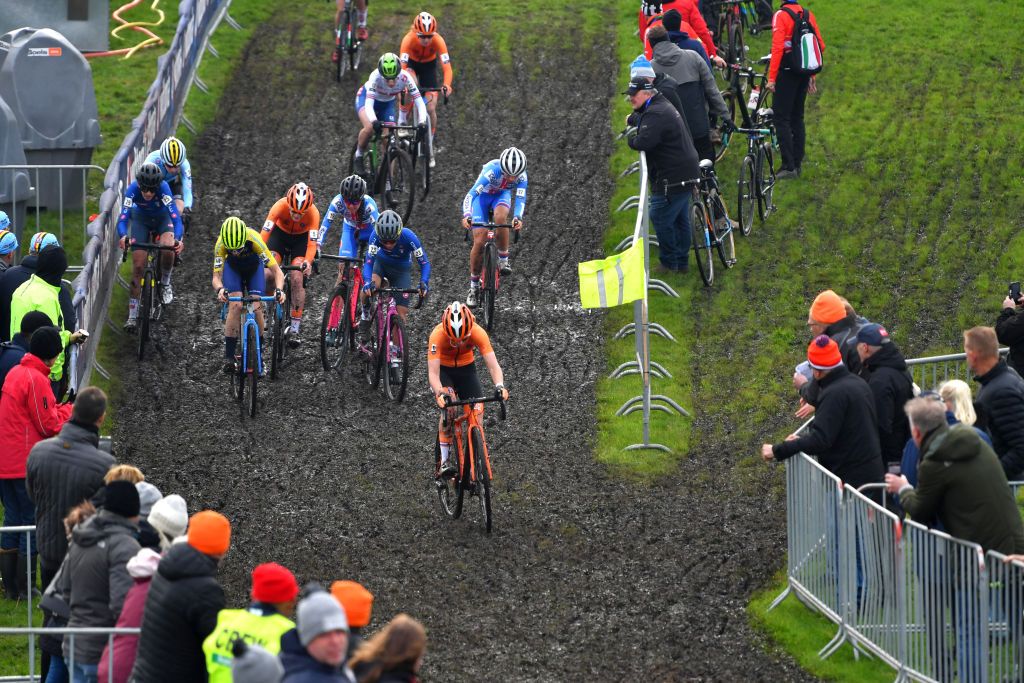 COL DU VAM DRENTHE NETHERLANDS NOVEMBER 06 A general view of the Peloton passing through a muddy sector during the 19th UEC European Cyclocross Championships 2021 Womens Junior EuroCross21 UECcycling on November 06 2021 in Col du Vam Drenthe Netherlands Photo by Luc ClaessenGetty Images
