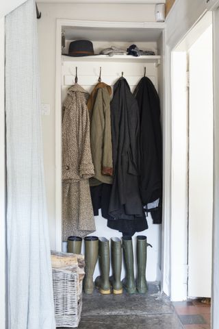 boot room storage in open cupboard hallway