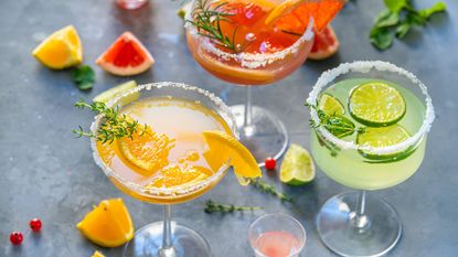 Different cocktails with fruits and herbs - stock photo