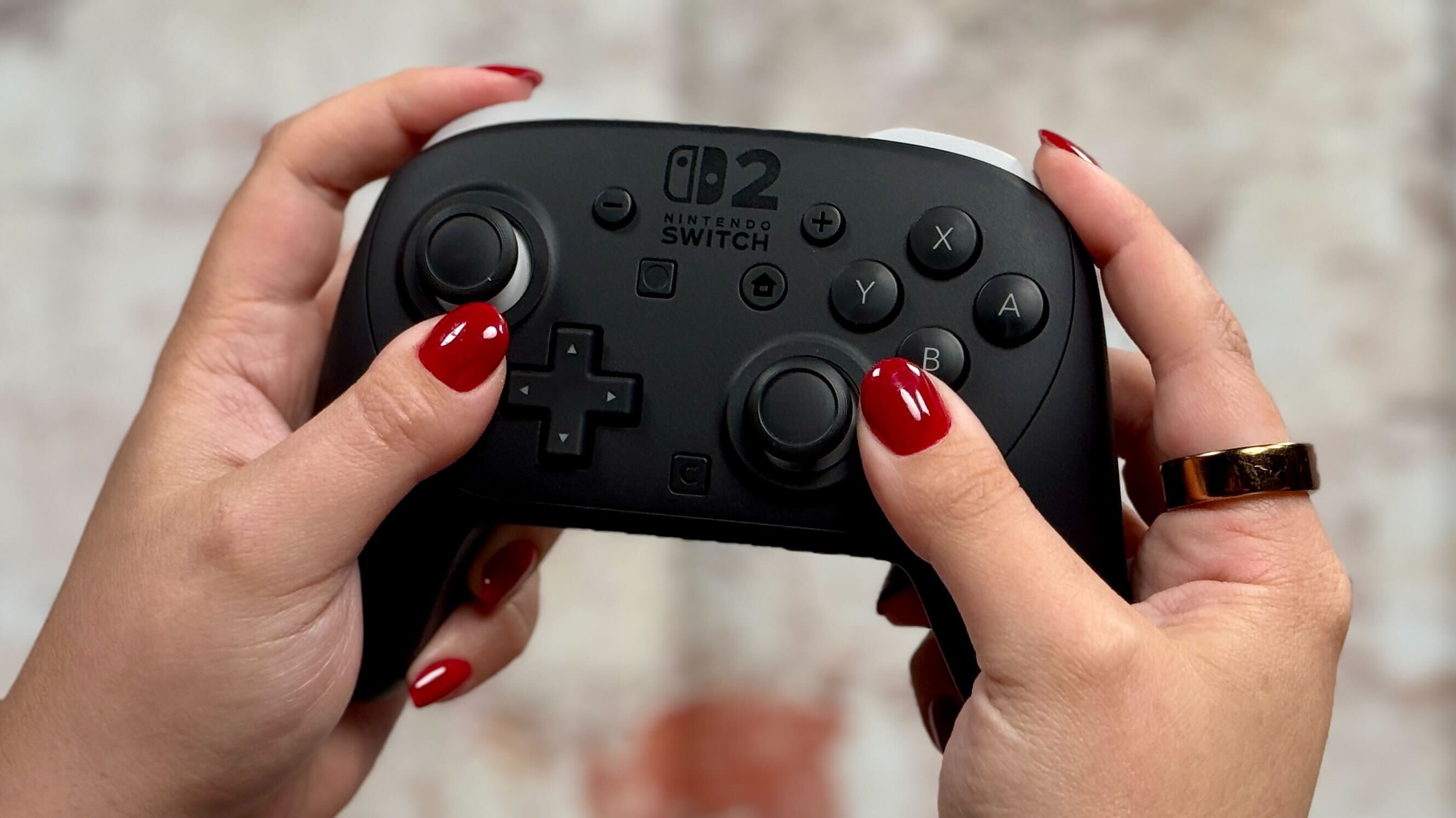 Nintendo Switch 2 Pro controller in two hands
