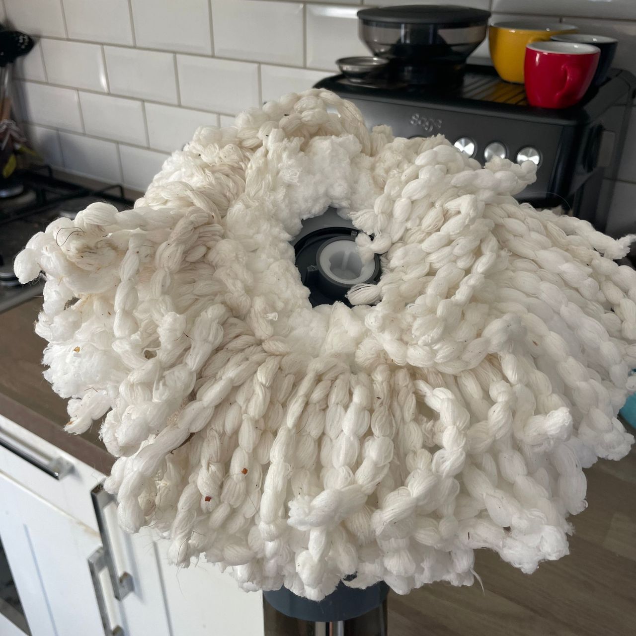 Minky Spritz &amp; Spin Spray Mop head in a kitchen