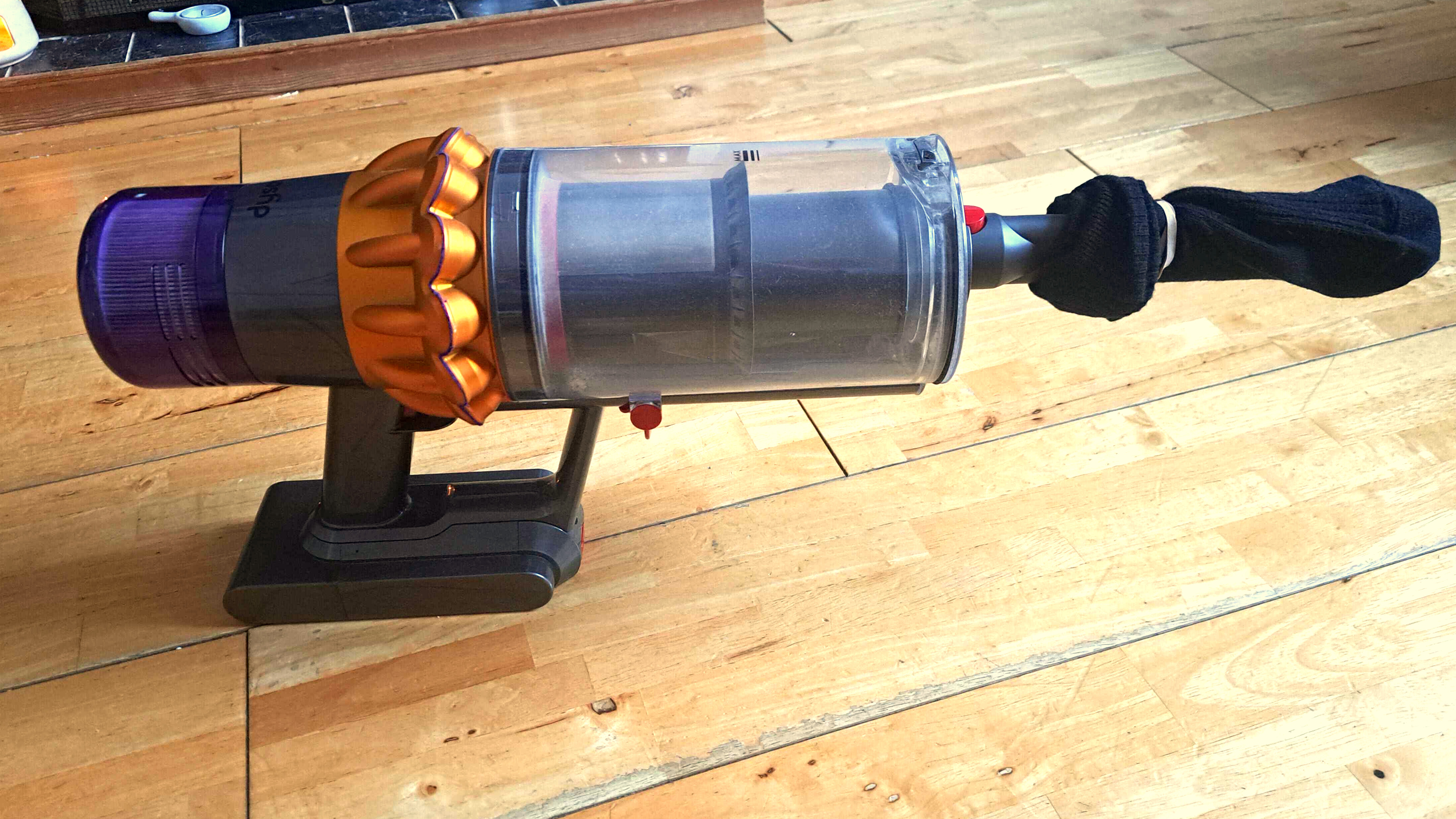 Dyson with sock on vacuum hose attachment
