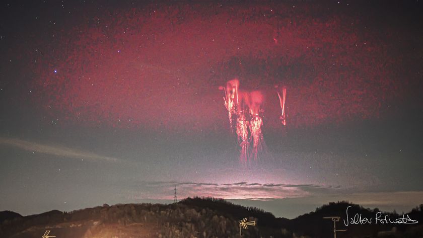 red halo elve shines above a bright jellyfish like lightning known as a sprite.
