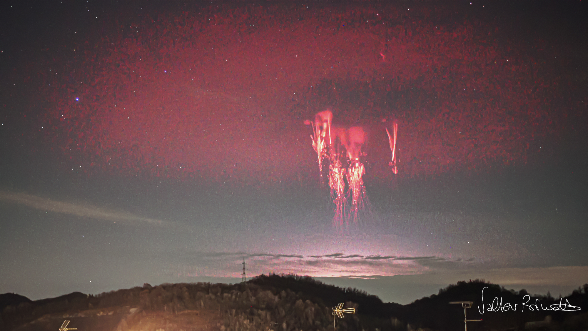 red halo elve shines above a bright jellyfish like lightning known as a sprite.