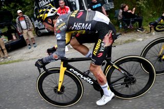 Primoz Roglic chasing after his stage 3 crash at the Tour de France