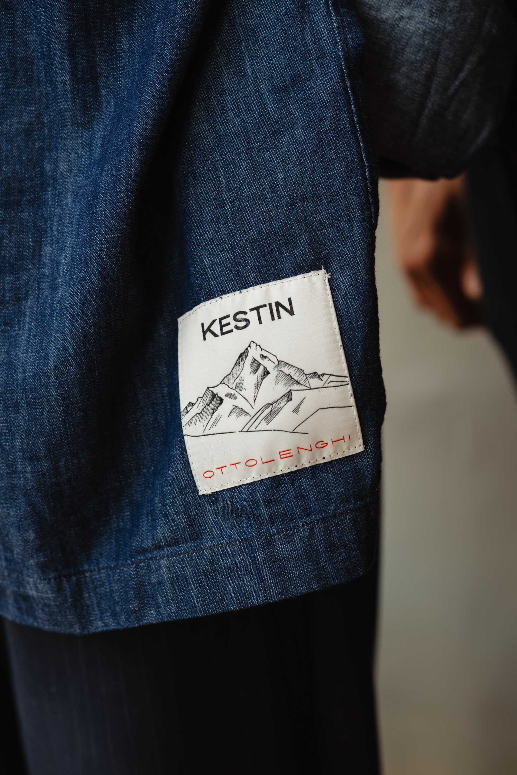 Kestin label on blue apron of Ottolenghi Edinburgh restaurant staff