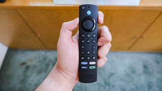 The Fire TV Cube (2022) remote in hand
