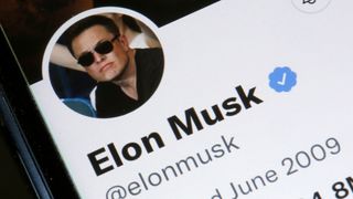 Elon Musk’s Twitter account is displayed on the screen of an iPhone on April 26, 2022 in Paris, France.