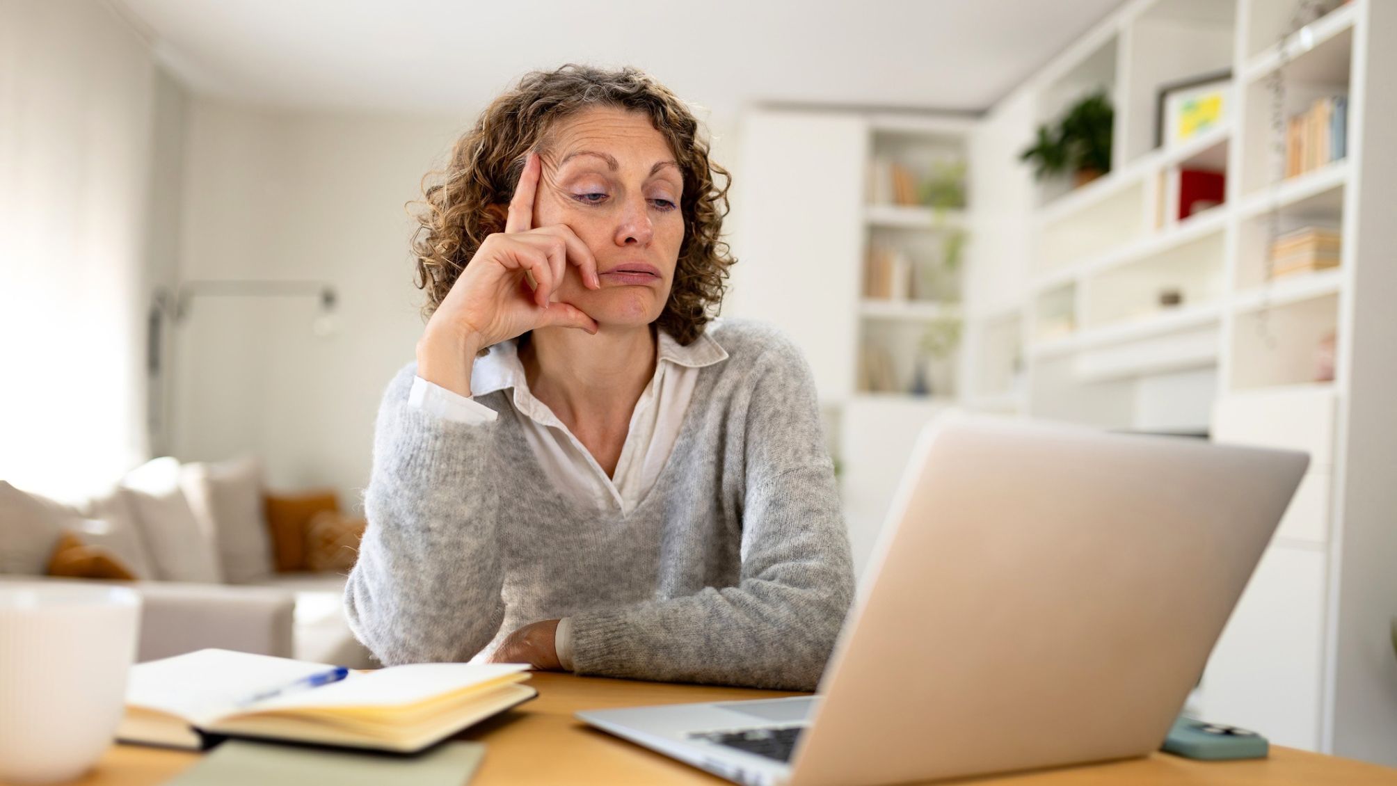 A woman frustrated with her computer.