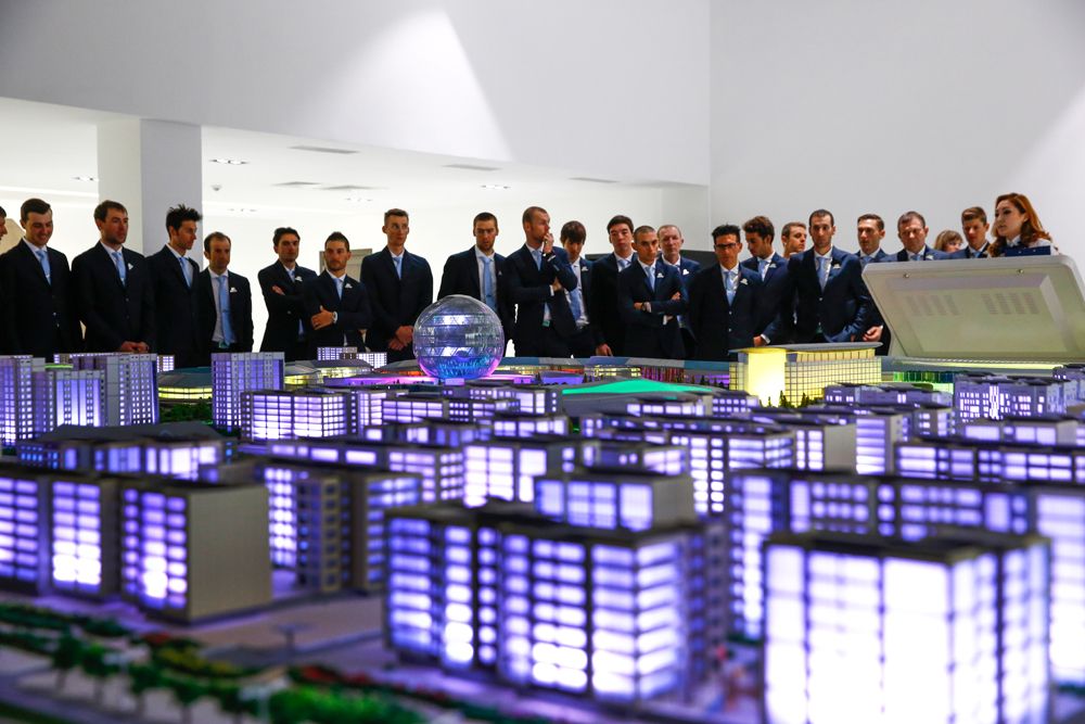 Riders looking over a city model
