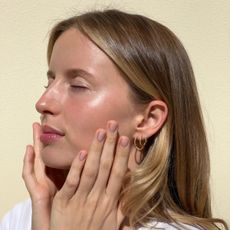 An image of a woman with glowing skin.