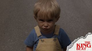 Gage looking up at truck in the road in Pet Sematary The King Beat