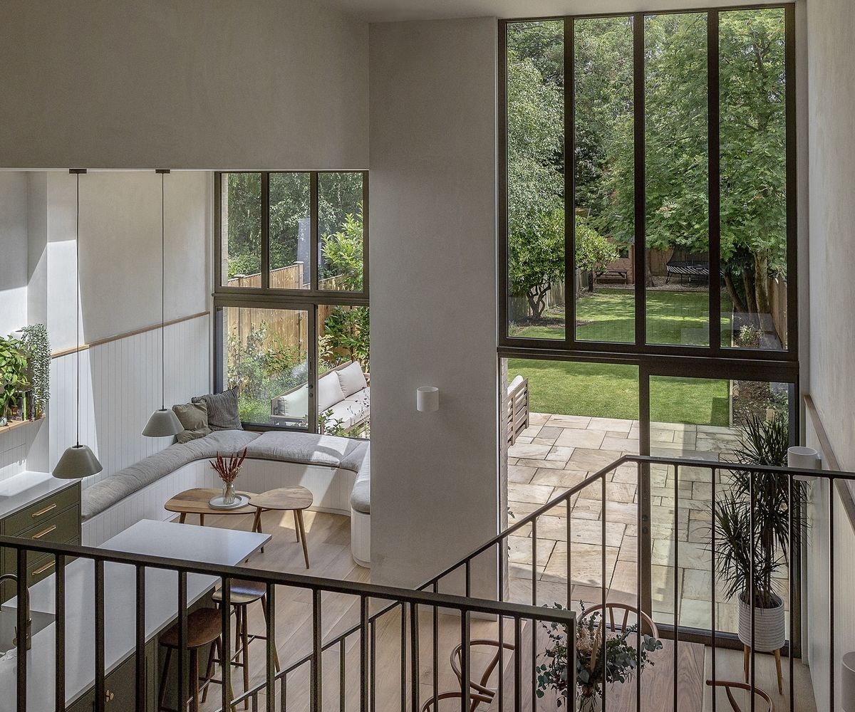 A light filled ground floor kitchen extension with double height ceilings and built in seating