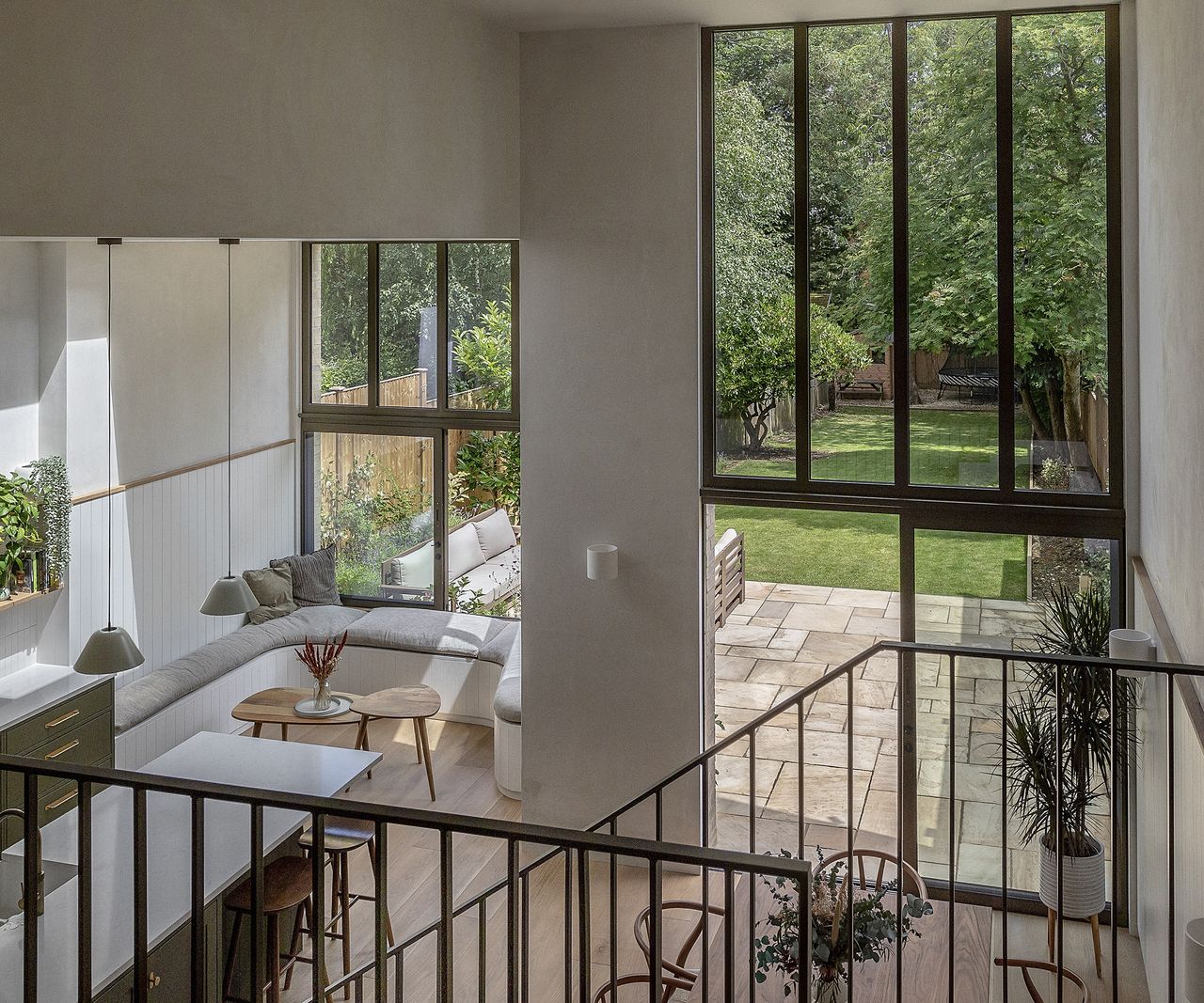 A light filled ground floor kitchen extension with double height ceilings and built in seating