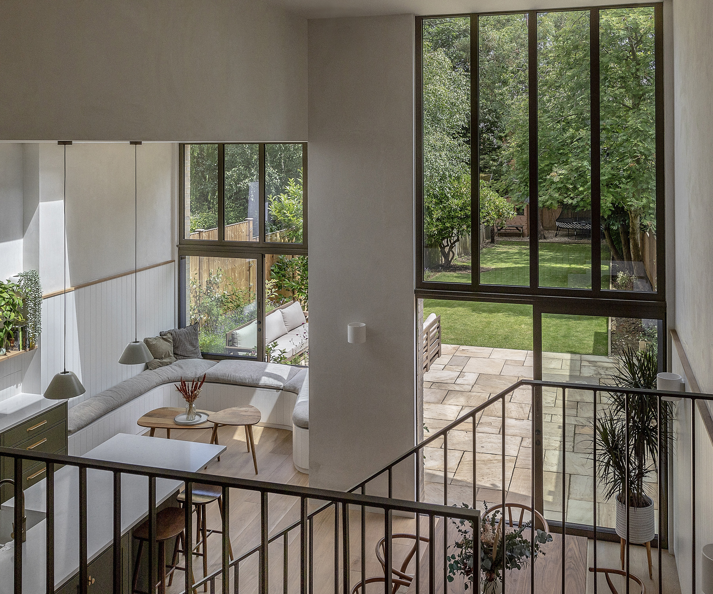 A light filled ground floor kitchen extension with double height ceilings and built in seating
