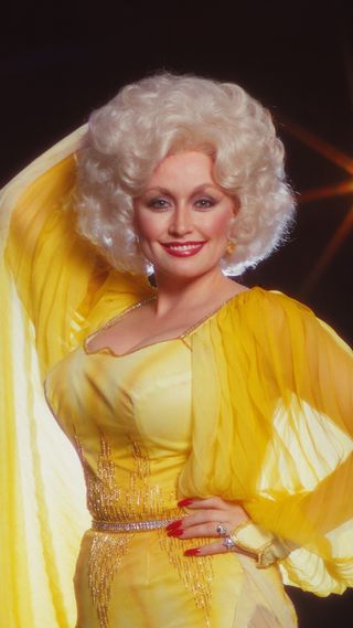 Dolly Parton in a yellow gown