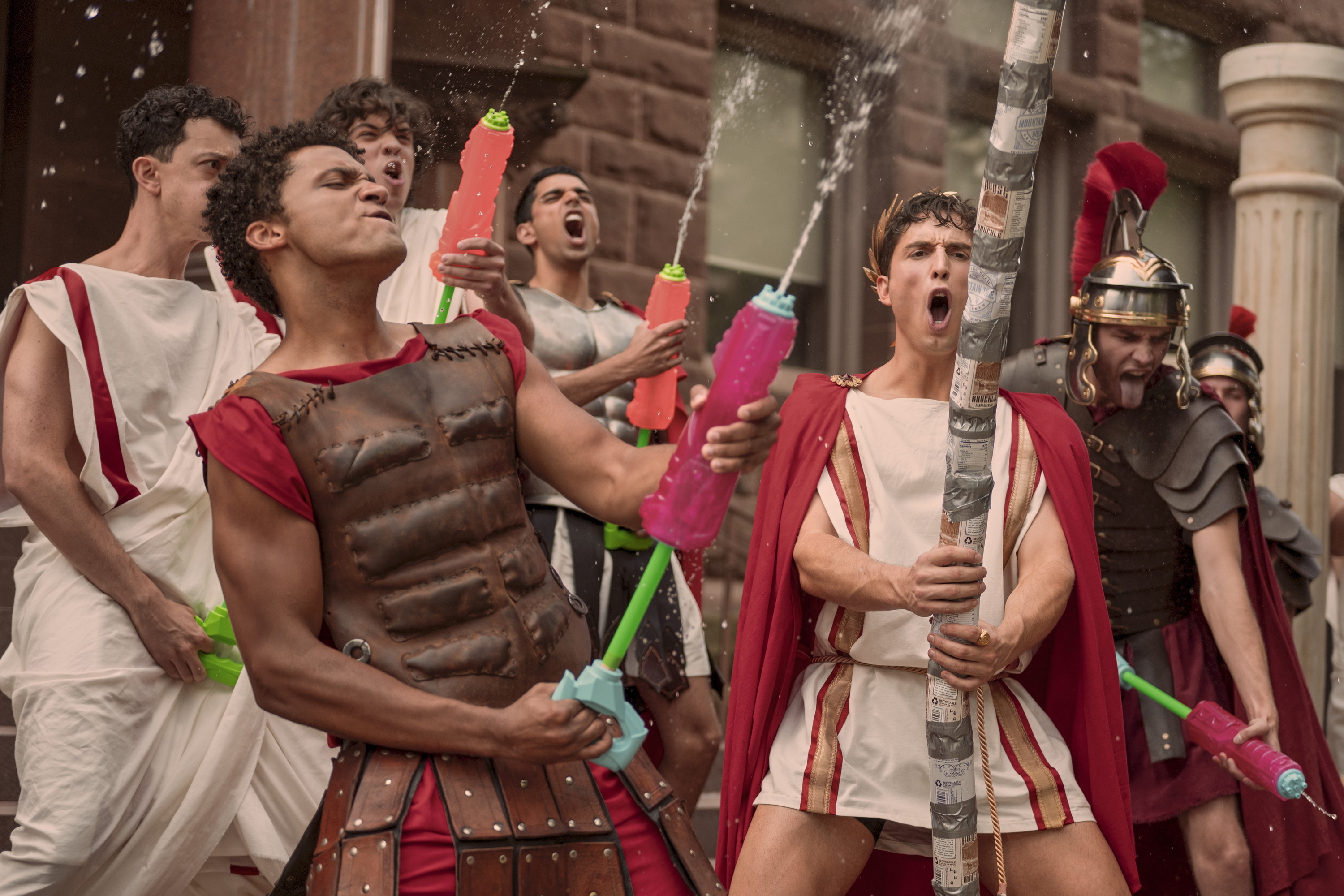 Corteon Moore, Benny (Benito Skinner) wearing toga greek uniforms at a frat party in OVERCOMPENSATING